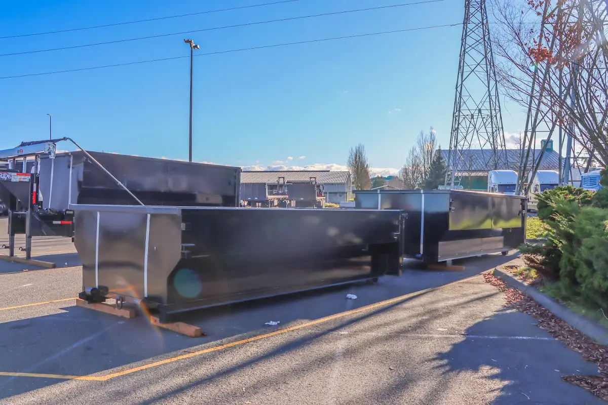 Roll-off dumpster ready for waste disposal at job site for Yard Waste Dumpster Rental in Bonham